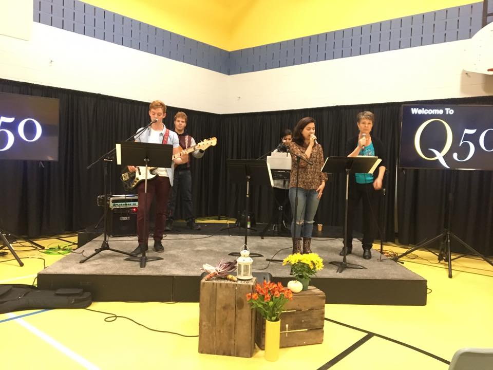 Q50 is currently meeting in a school gymnasium.