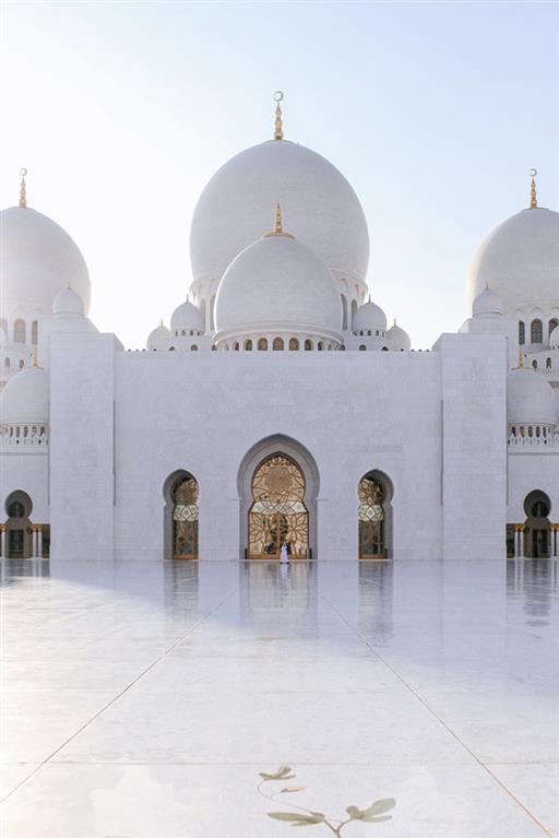 Photo of a white mosque.