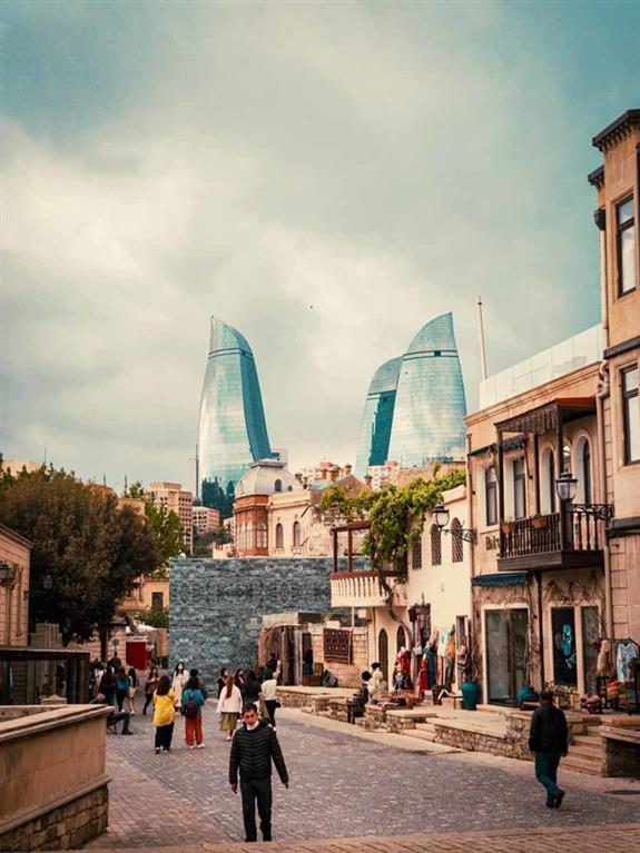 Man walking in the street in Azerbaijan's capital city.